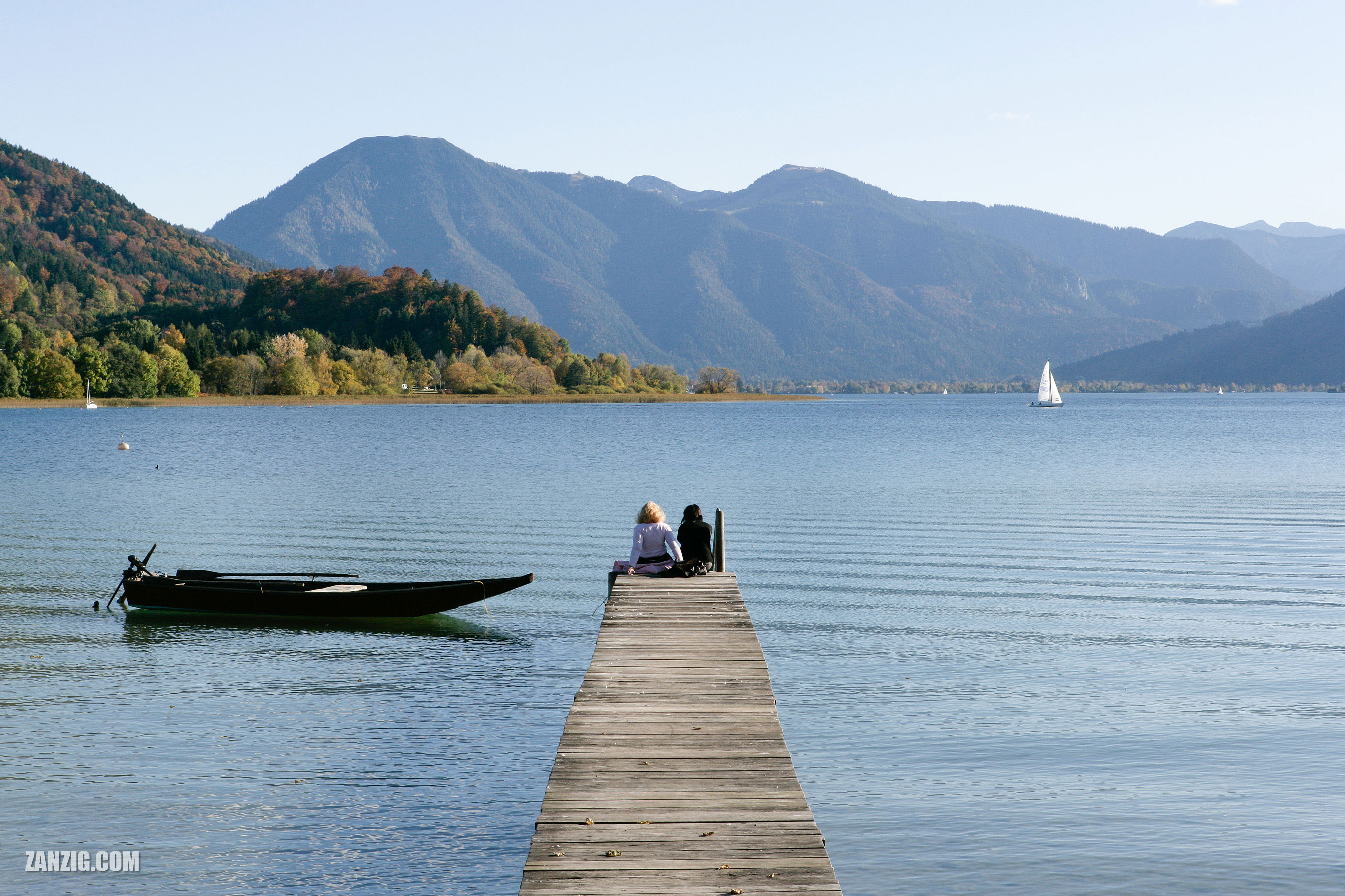 Two women enjoy a sunny afternoon with a spectacular view at Gmund am Tegernsee in Bavaria, Germany.